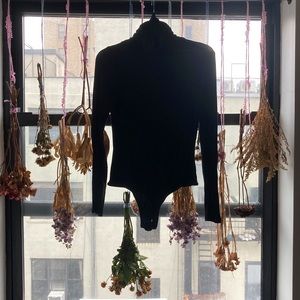 Black turtleneck bodysuit
